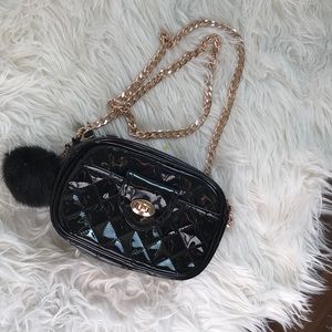 Shiny black Ariana Grande bag